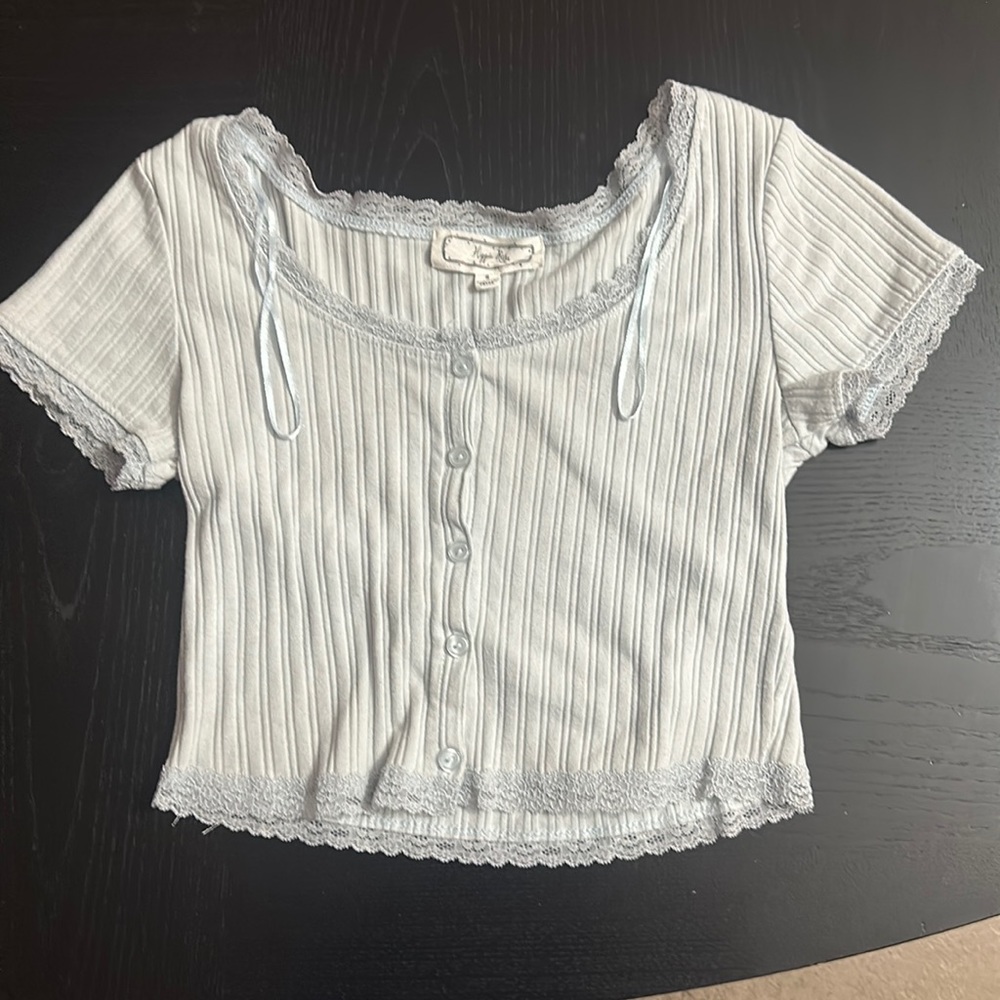 Juniors light blue top in size small.